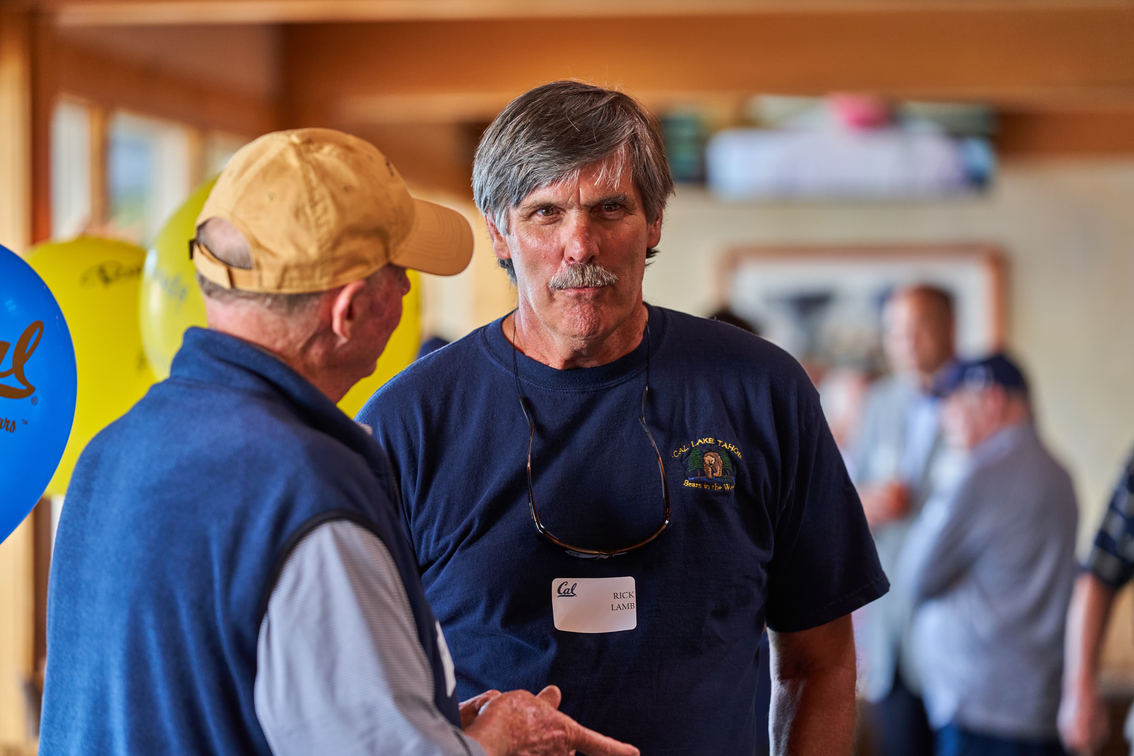 Members networking at an alumni event